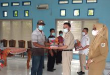 Tingkatkan Ekonomi Masyarakat, Pemerintah Serahkan Bantuan Benih Sekda Kotamobagu Ir Sande Dodo MT