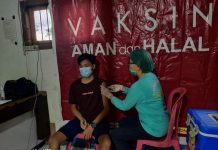 Ini Jadwal dan Lokasi Pelaksanaan Vaksinasi Covid-19 Salah satu warga saat mengikuti program vaksinasi Covid-19