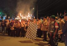 Sambut HUT RI ke-80, Disdikbud Bolsel Dampingi Siswa Ikuti Pawai Taptu